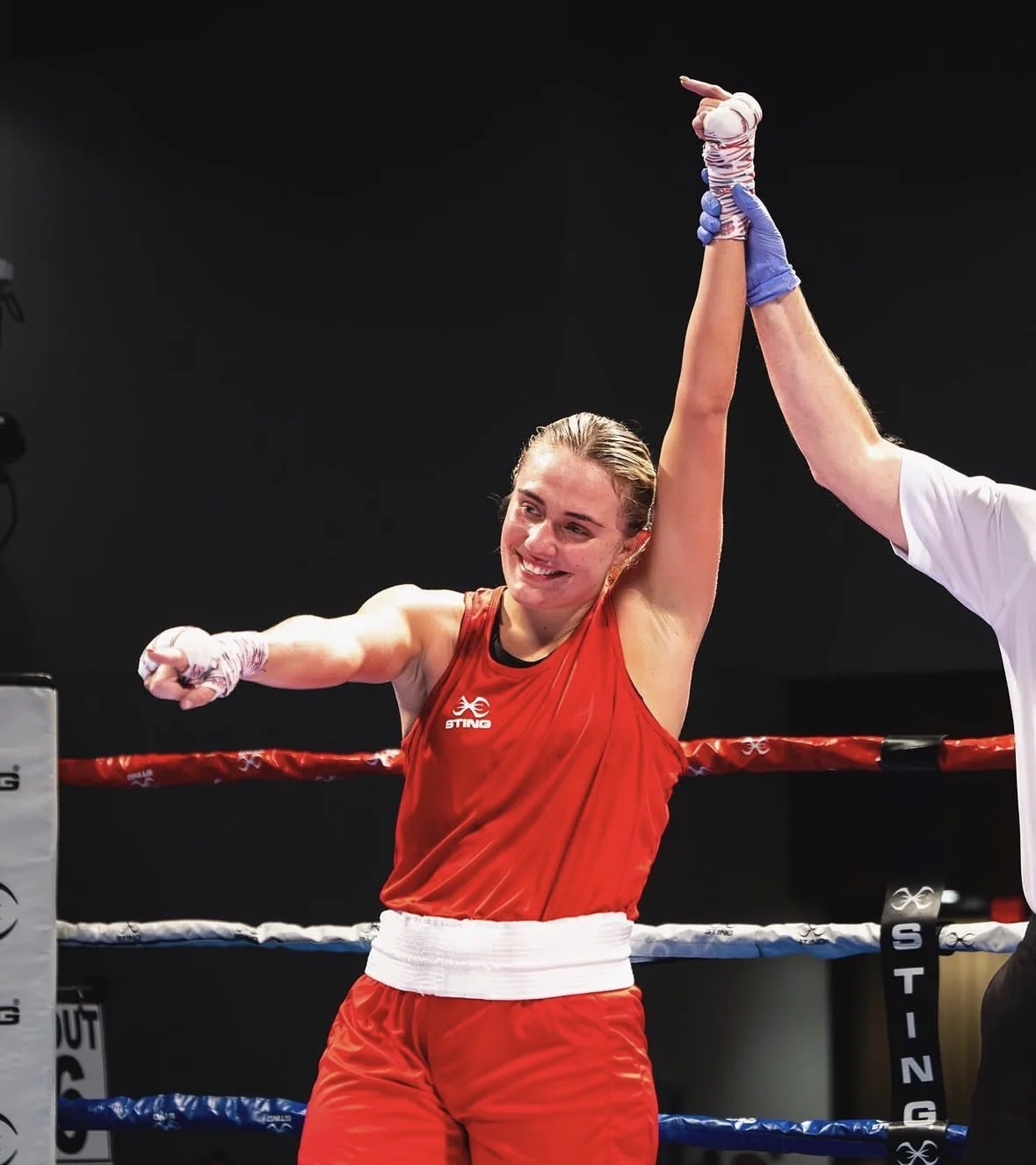 Gemma's hand raised after victory